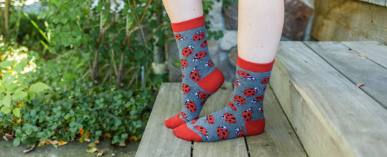 Woman lounging in Ladybug Socks in the Garden